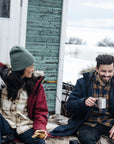couple enjoying coffee on snowy environment