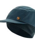 Blue cap with a Fjällräven logo on a white background