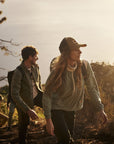 people hiking on a mountain trek