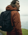 man in black backpack on a mountain