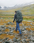 men carrying trekking backpack and trekking