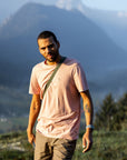 man in chalk rose round neck t-shirt with arctic fox logo hiking
