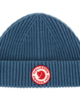 Blue knit beanie with a red Fjällräven logo on a white background