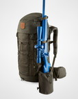 Green backpack with a blue rifle attached on a white background