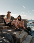 woman hanging out on coastal staircase
