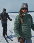 two men skiing wearing padded down winter jacket