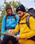 men exploring the map on a trekking trip