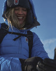 woman wearing blue padded down winter jacket