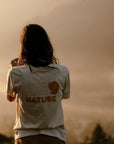 woman wearing chalk white round neck t-shirt with arctic fox logo
