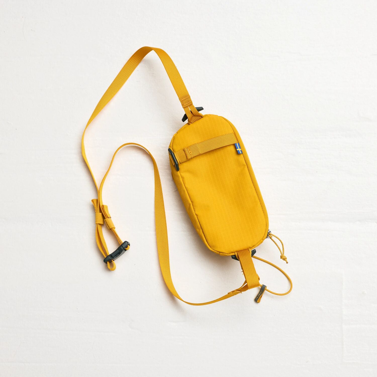 Yellow crossbody bag on a white background