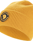 Yellow knit beanie with a Fjällräven logo on a white background