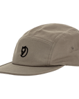 Beige cap with a arctic fox logo on a white background