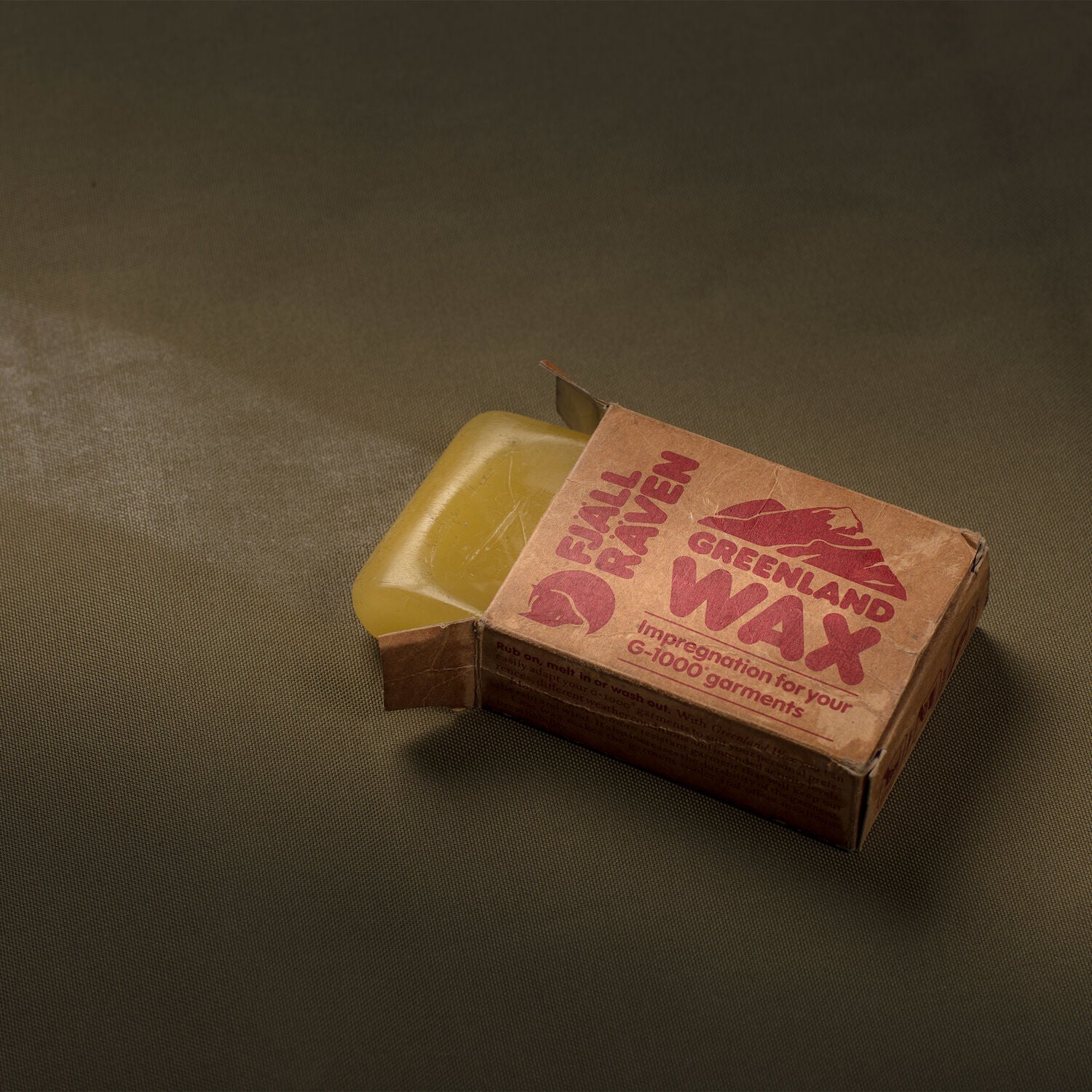 Greenland wax block on a dark background