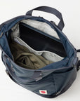 Open blue backpack with items inside on a white background