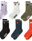 Set of six pairs of socks in various colors with a fjallraven logo on a white background