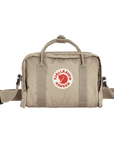 Beige waist bag with Fjällräven Kånken logo on a white background