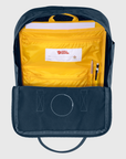 Navy and yellow backpack with a visible Fjällräven label on a light gray background