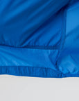 Close-up of a blue jacket with a white background