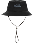 Black bucket hat with a Fjällräven logo on a white background