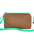 Brown bag with a green strap on a white background