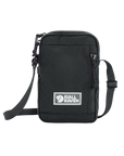 Black crossbody bag with Fjällräven logo on a white background