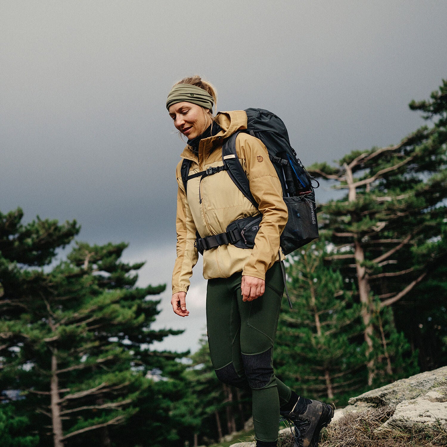 Person hiking with a backpack in a forested area