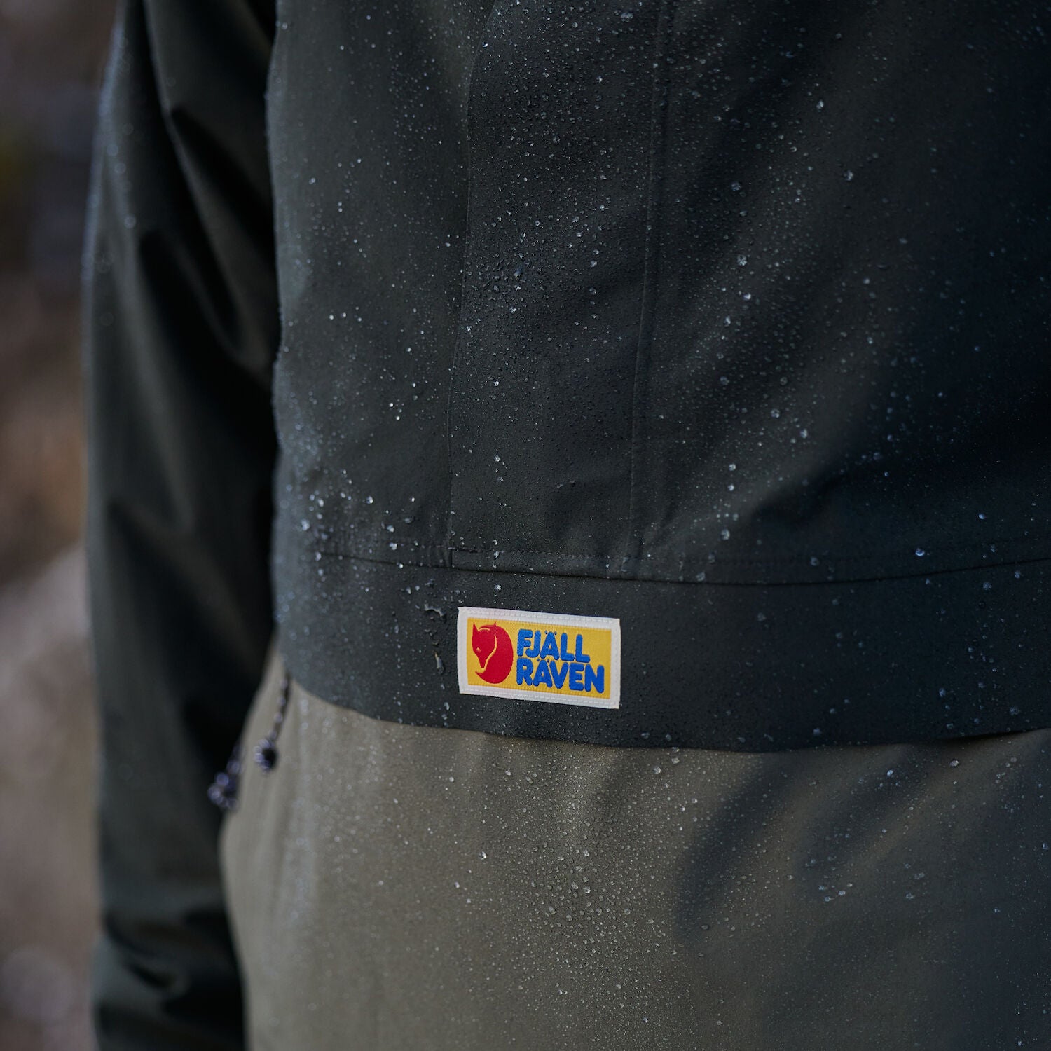 close up of raincoat jacket with Fjällräven logo