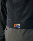 close up of raincoat jacket with Fjällräven logo