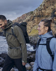 couple hiking on rocky coast