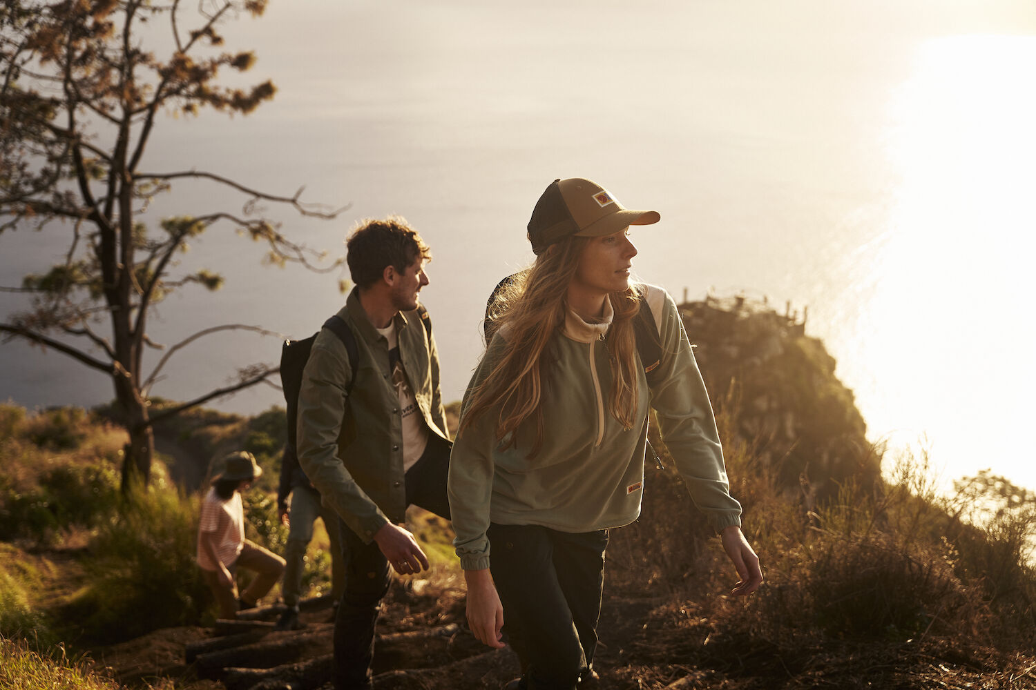 people hiking on a mountain trek