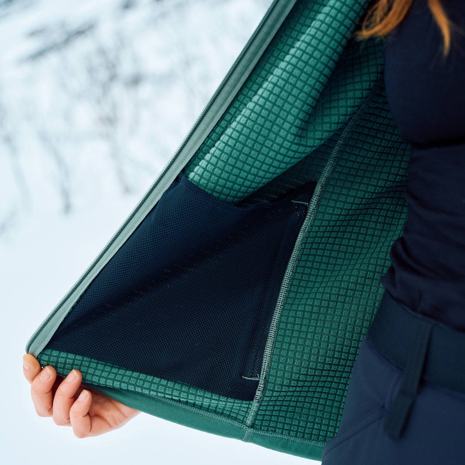 interior pocket of green fleece jacket 