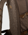 Close-up of a brown backpack with straps on a light gray background