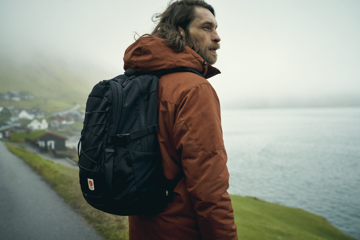 man in black backpack on a mountain