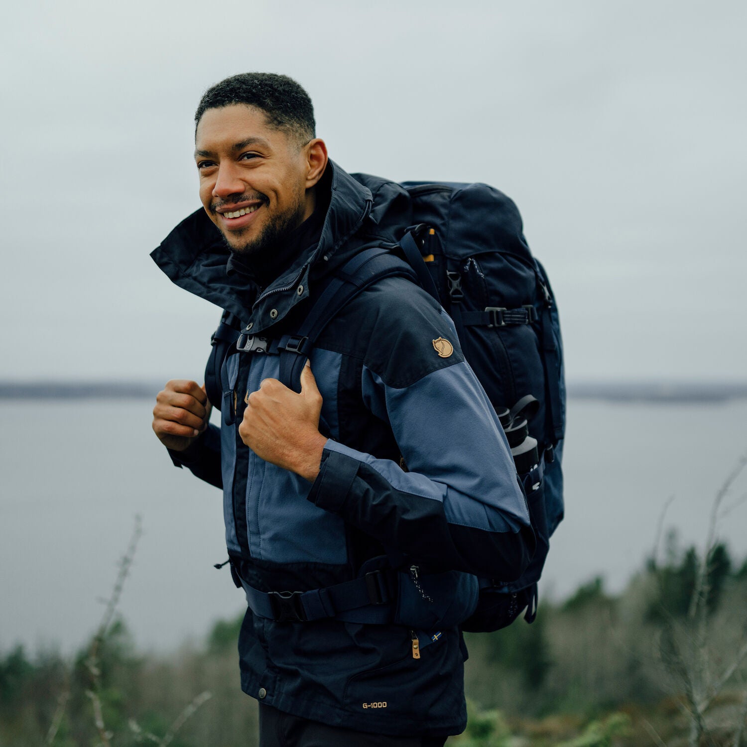 man wearing dark navy-uncle blue jacket