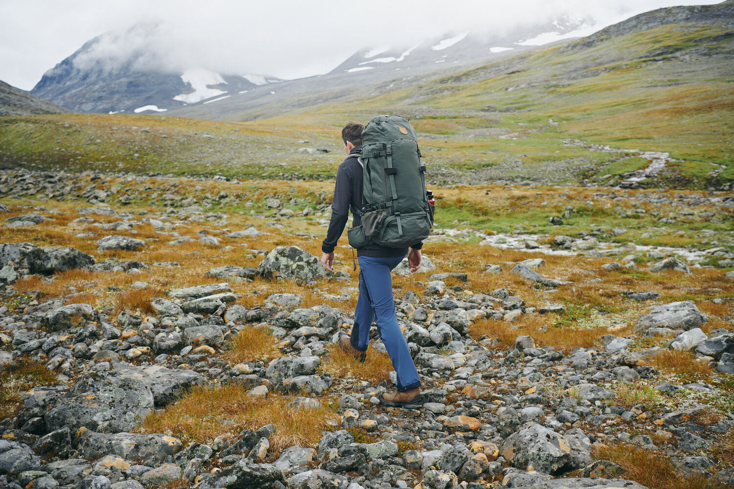 men carrying trekking backpack and trekking