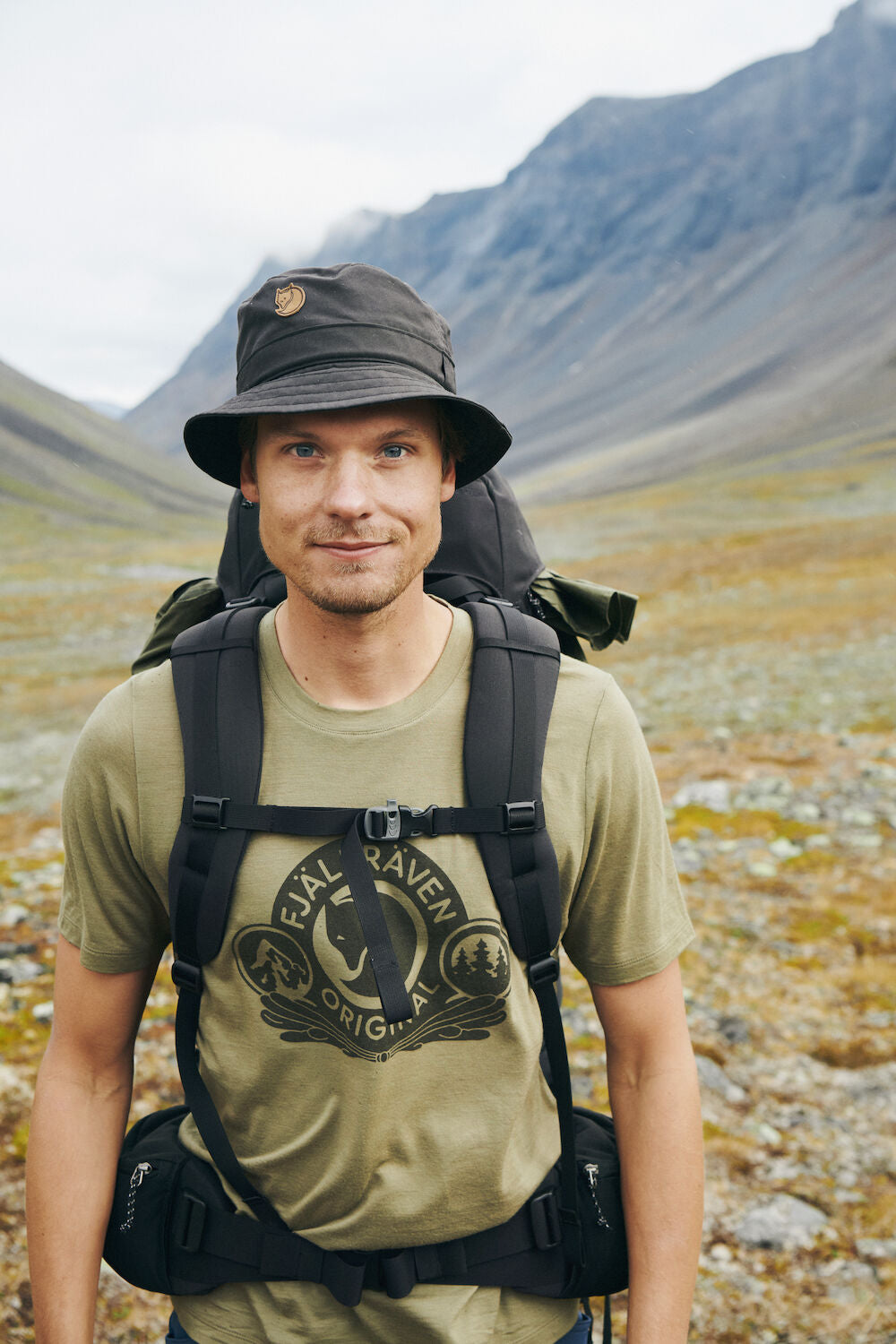 Man with a backpack in a mountainous landscape