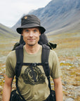 Man with a backpack in a mountainous landscape
