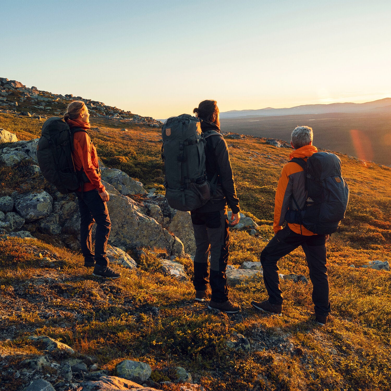 three people enjoying the hike while carrying hiking backpacks