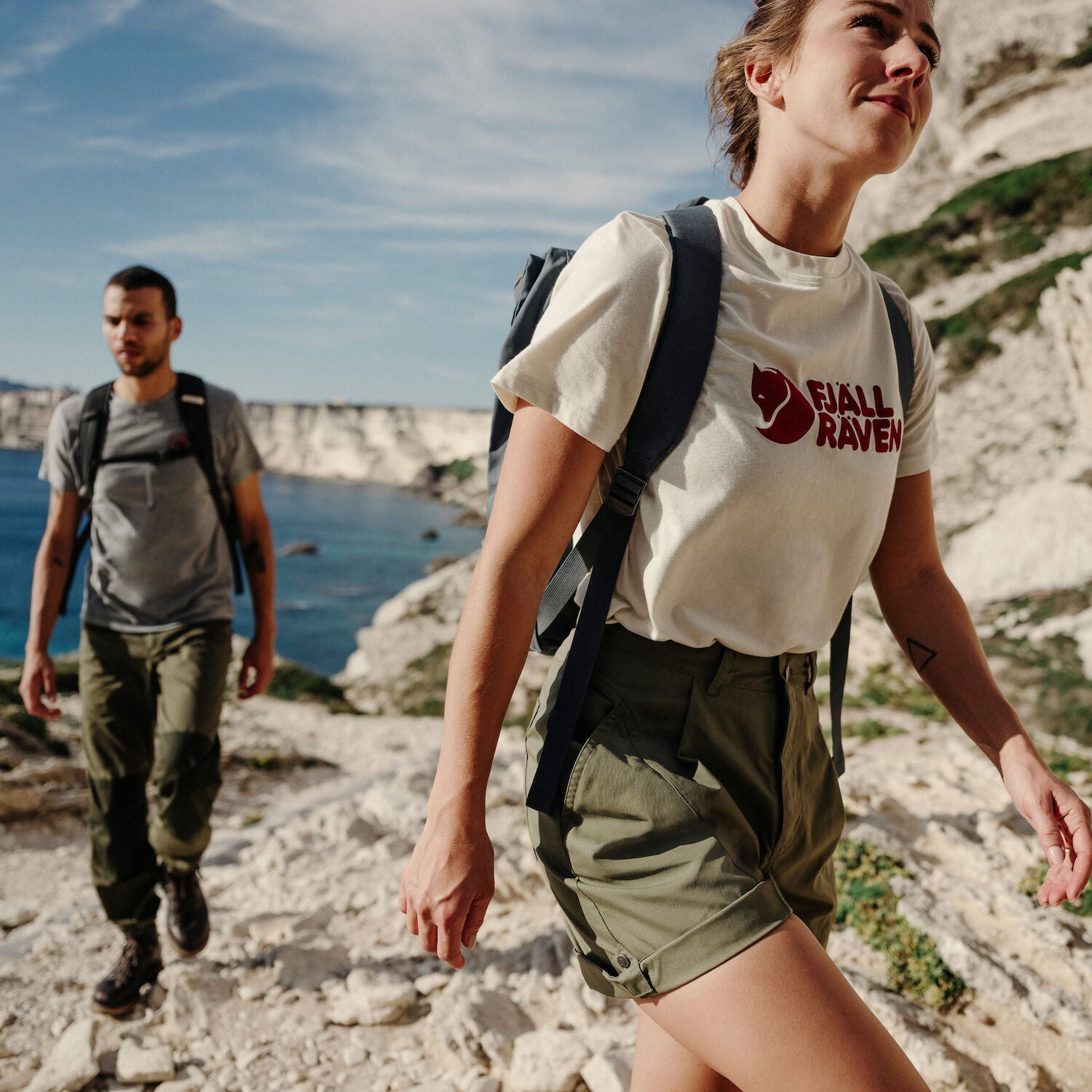 couple wearing t-shirt and shorts on a trekking trip