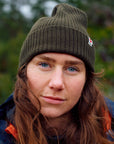 woman in deep forest beanie with Fjällräven logo
